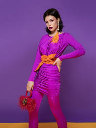 purple dress and an orange belt