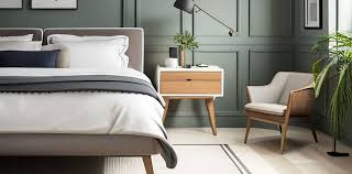 guest bedroom with white bedside table
