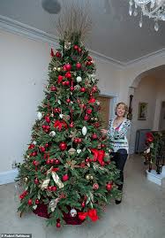 The interior of a home may be decorated with these plants, along with. Meet The Woman Who Pays A Team Of Five 2 000 To Decorate Her Three Christmas Trees Daily Mail Online