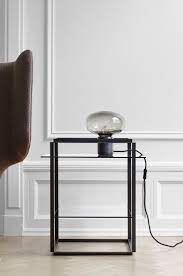 This soothing lamp combines the soft curves of glass with strong materials. Karl Johan Table Lamp Black Marquina New Works