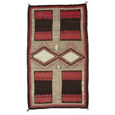 past auction navajo rug with unusual