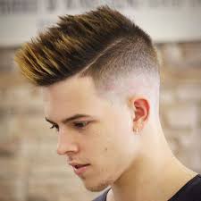 The faux hawk or fohawk haircut is considered ago to look for the modern man. Men S Faux Hawk Taper Fade Haircut Hipster Haircut Mens Hairstyles Short Haircuts For Men