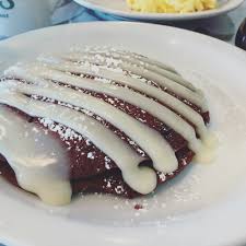 red velvet pancakes with white chocolate sauce
