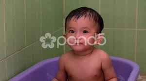 Baby tubs, buckets and baths come in all shapes and sizes and are great for washing your baby easily anywhere. Baby Bath Stock Video Footage Royalty Free Baby Bath Videos Page 4