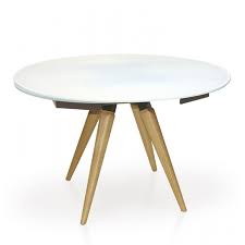 Increase your dining space with an extendable dining table. Myles Extending Round Dining Table With Wooden Legs Casa