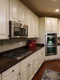 White and navy kitchen features white shaker cabinets paired with. 9 Tan Brown Granite Ideas Kitchen Remodel Kitchen Design Kitchen Cabinets