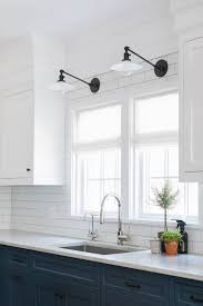Hogan Kelly Design Task Wall Lights Over Kitchen Sink Blue And White Cabinets White Subway Ti Kitchen Wall Lights Cottage Kitchen Design White Subway Tiles