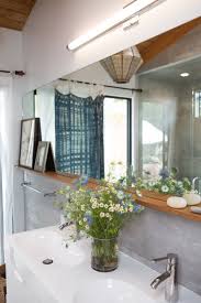 The mirror has a square shape with a thin black frame. Frameless Bathroom Mirror Ideas Easy Budget Upgrades Apartment Therapy