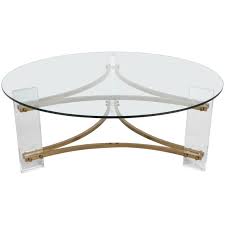 Our pieces are of high quality, unique, and handcrafted, so it will be a statement piece like no other. Hollywood Regency Round Lucite And Brass Coffee Table For Sale At 1stdibs
