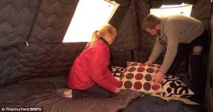 Learn 27 essential tips that will help you stay warm in your tent and brave the cold when you're camping in it's natural to only think about a cold tent in the winter, but it is not uncommon to find summer weather giving way to cold air come evening. Camping Gets Comfortable Insulated Tent Keeps You Warm In Winter Cool In Summer And Blocks Out Noisy Neighbours Daily Mail Online