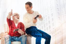 Happy Pensioner Pointing To the Screen while Playing Video Games with Son  Stock Photo - Image of communication, millennials: 108401578
