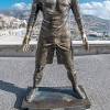 Cristiano ronaldo poses with questionable bronze statue time. 1
