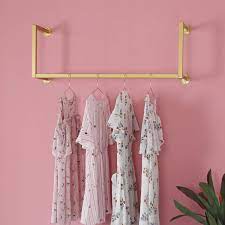 Not only do we sell racks & shelving, but we also offer delivery, installation, dismantling, complete facility relocation, powder coat painting and much more. Amazon Com Gold Clothing Rack Wall Mounted Clothes Rack Modern Clothes Hanging Bar Space Saving Vintage Retail Garment Rack Home Improvement