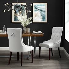 White dining room decorated with carved wood wall arts and vintage candle centerpieces on top of the wooden dining table. Inspired Home Faith Leather Pu Dining Chair Set Of 2 Tufted Ring Handle Chrome Nailhead Finish White Walmart Com Walmart Com