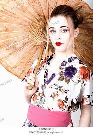 geisha holding a chinese umbrella
