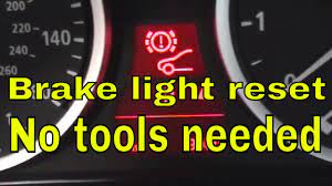 how to reset brake pad light on bmw