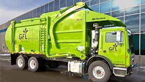 big green garbage trucks push rizzo to