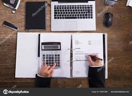 High Angle View Businessperson Hand Calculating Bill Calculator