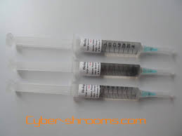A syringe filled with a sterile water solution that contains mushroom spores. Spores Bought Cyber Shrooms