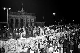 what history tells us about building a wall to solve a problem east and west german citizens celebrate as they climb the berlin wall at the brandenburg gate after the opening of the east german border 9 1989