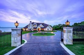 gated lakefront stone home in heath