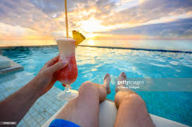 Personal Perspective Of Man Holding A Cocktail In Seaside Swimming Pool  Mexico High-Res Stock Photo - Getty Images