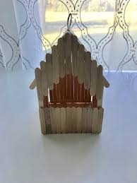 A Birdhouse Out Of Craft Sticks