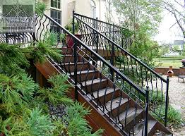 Iron handrails for concrete steps range in price from $60 to over $150 per running foot. Wrought Iron Railing Custom And Pre Designed Anderson Ironworks