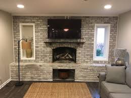 painted brick fireplace with white trim