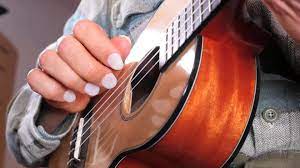 how to finger pick guitar with nails
