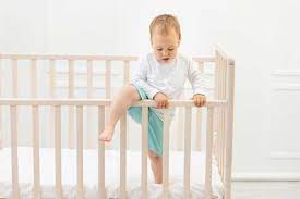 guide to crib mattress height when