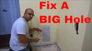 Make sure the spackle completely fills the dent or hole and is level with the rest of the undamaged wall. How To Fix A Big Hole In The Wall Youtube