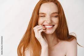 close up of happy redhead woman with