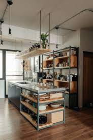 Large industrial kitchen with hardwood flooring and white walls. Industrial Kitchen Design Ideas Industrial Kuche Kolumbus Von Everingham Design Houzz