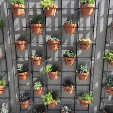 I'm attempting to hang a curtain rod over my bedroom window in my condo, but i'm running into troubles. Turning An Outdoor Wall From Drab To Dreamy The Design Team At Bunnings Welded Rods Of Reinfo Vertical Garden Pots Terracotta Plant Pots Vertical Garden Wall