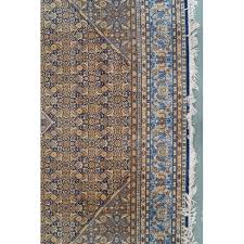 a blue and beige patterned ground prado