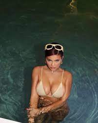 Kylie Jenner slips into gold bikini for ...