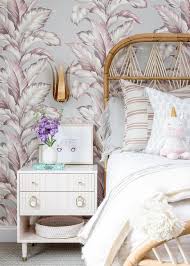 girls room with gray and pink wallpaper