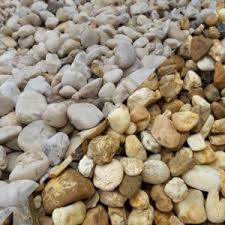 Using landscaping rocks is a valuable addition to the outdoor area of any house. White And Brown River Rock Southern Landscaping Materials