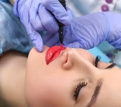 cosmetologist making permanent makeup