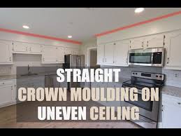 how to install crown moulding on uneven