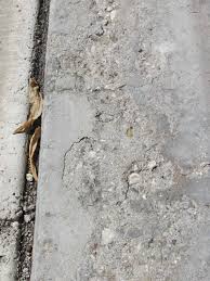 concrete deterioration by the garage