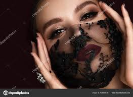 beautiful woman in a black lace mask