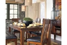 Enjoy your next gathering at this extending dining room table, side chair and dining bench set. Ralene Extendable Dining Table Ashley Furniture Homestore