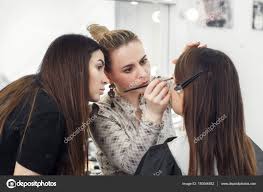 makeup artist working in studio stock