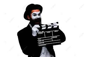 mime artist posing with clapperboard in