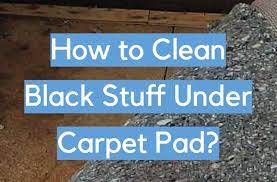 clean black stuff under carpet pad