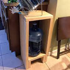 The spigot with that unit can be turned around within the cap so that the spigot can be secured with the unit, stowed. Made A Simple 5 Gallon Water Jug Holder From One 2x12x8 Click To See The Diy For This And Projects Like It D Gallon Water Jug Diy Holder Wood Craft Projects