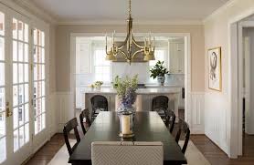 This is a classy, simple, yet interesting timeless chandelier that goes perfect over our rectangle dining table. Ebony Dining Table And Chairs With Gold Chandelier Transitional Dining Room