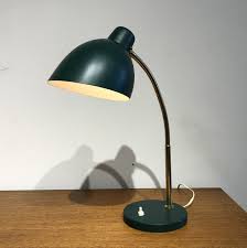 Adjustable desk lamps feature rotating lamp heads and arms with articulating joints that allow you to customize the direction the light is cast and the spread of the light beam. Adjustable Desk Lamp By Robert Pfaffle For Erpees 1960s 160815